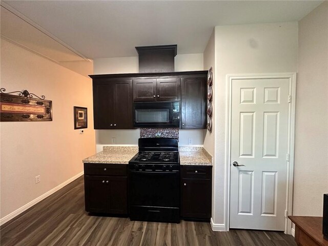 803 Molina St, Robstown, TX 78380 - kitchen with black appliances, dark wood-type flooring, baseboards, and light stone countertops
