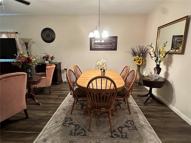 803 Molina St, Robstown, TX 78380 - dining area with a chandelier, dark wood finished floors, and baseboards