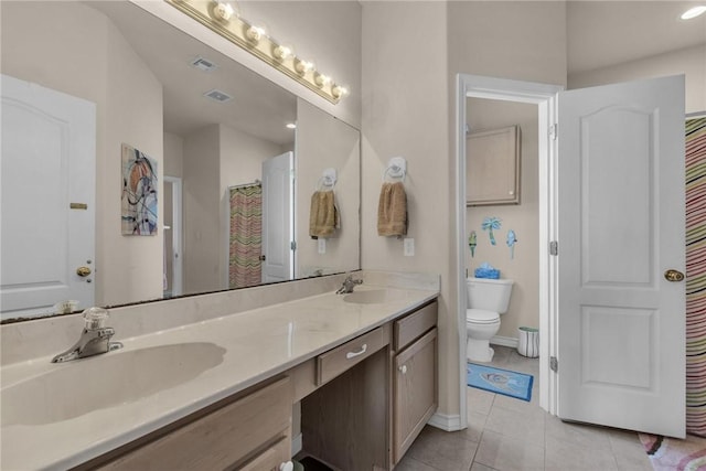 14901 Windward Dr Unit 704, Corpus Christi, TX 78418 - full bathroom featuring a sink, tile patterned floors, toilet, double vanity, and visible vents