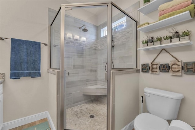 14901 Windward Dr Unit 704, Corpus Christi, TX 78418 - bathroom with toilet, a stall shower, and baseboards
