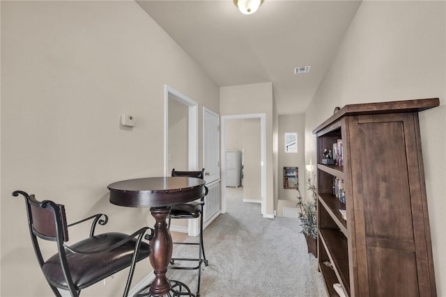 14901 Windward Dr Unit 704, Corpus Christi, TX 78418 - dining room featuring visible vents, washer / clothes dryer, carpet flooring, and baseboards