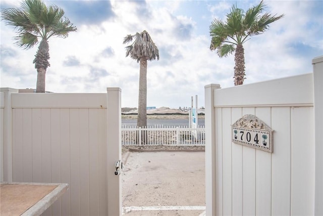 14901 Windward Dr Unit 704, Corpus Christi, TX 78418 - view of gate featuring fence