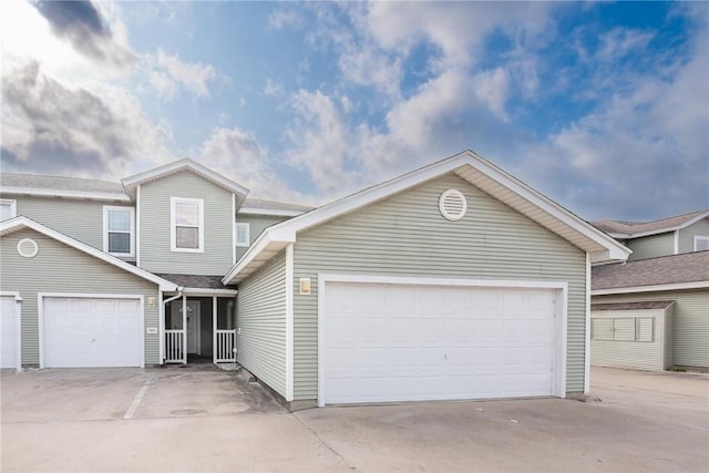 14901 Windward Dr Unit 704, Corpus Christi, TX 78418 - view of front facade with concrete driveway and a garage