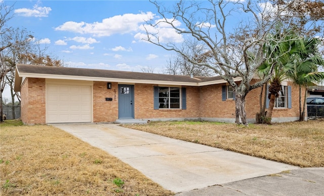 ranch-style house with a front yard and a garage