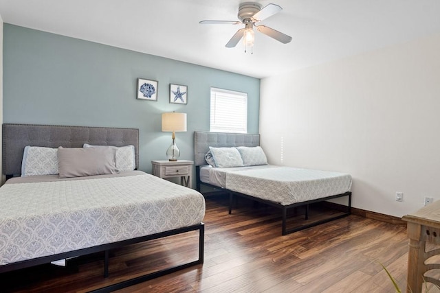 bedroom with wood-type flooring and ceiling fan