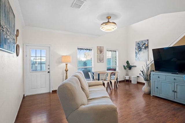 living room with crown molding, dark hardwood / wood-style floors, and a wealth of natural light