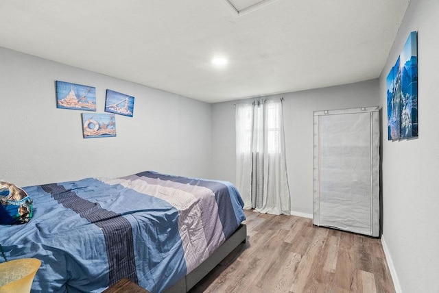 647 W Main Ave, Robstown, TX 78380 - bedroom with wood finished floors and baseboards