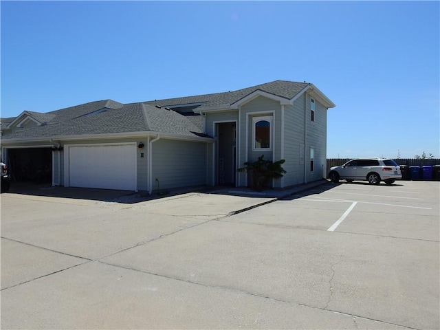 view of front of house with a shingled roof