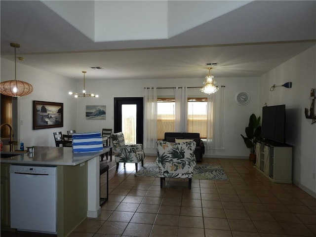 interior space with visible vents, a notable chandelier, dark tile patterned floors, and baseboards