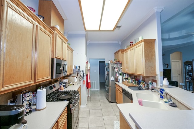 kitchen featuring ornamental molding, stainless steel appliances, sink, and light tile patterned floors