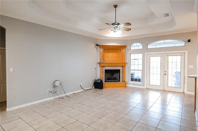 living room with arched walkways, a raised ceiling, crown molding, and ceiling fan