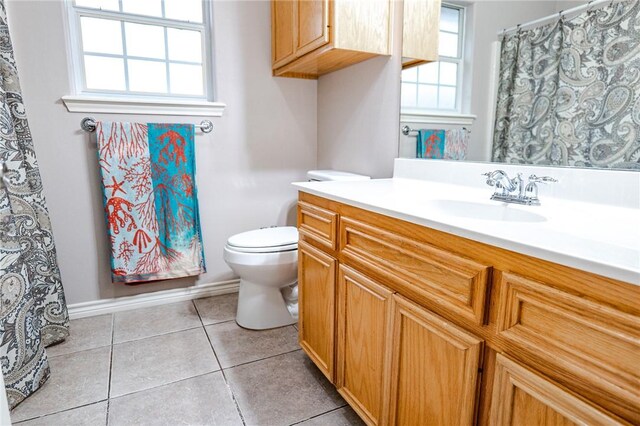 full bathroom featuring a stall shower, vaulted ceiling, a spacious closet, and tile patterned floors