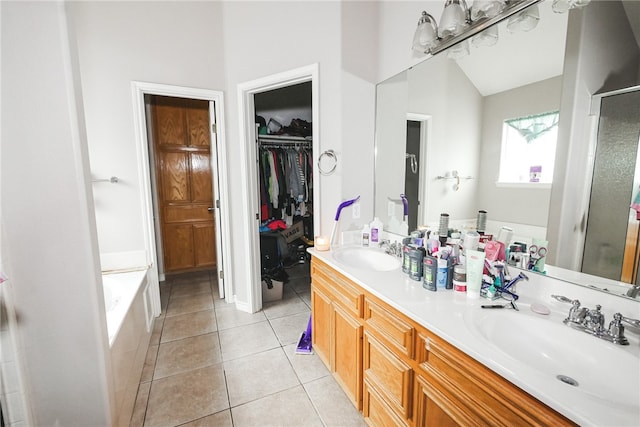 bathroom featuring vanity, tile patterned floors, and separate shower and tub