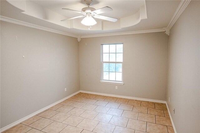 bedroom with ceiling fan, a tray ceiling, ornamental molding, and tile patterned floors