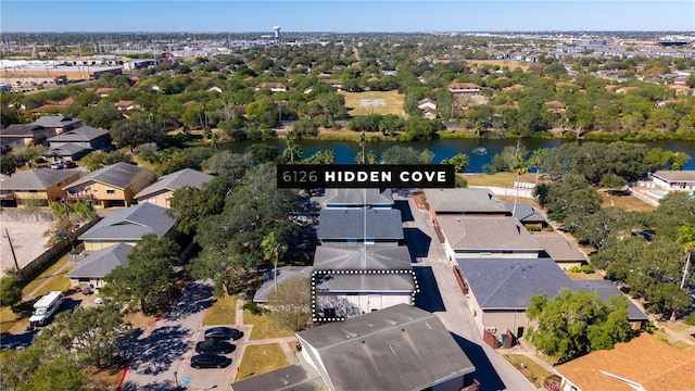 birds eye view of property featuring a water view