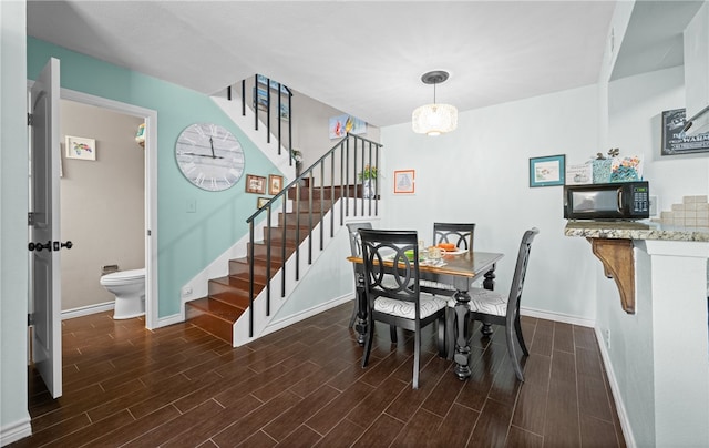 dining room with dark wood-type flooring