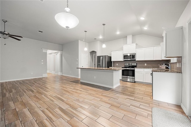 10113 Maverick, Corpus Christi, TX 78410 - kitchen featuring tasteful backsplash, ceiling fan, open floor plan, a kitchen island, and appliances with stainless steel finishes