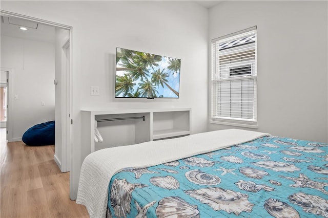 bedroom with light hardwood / wood-style flooring