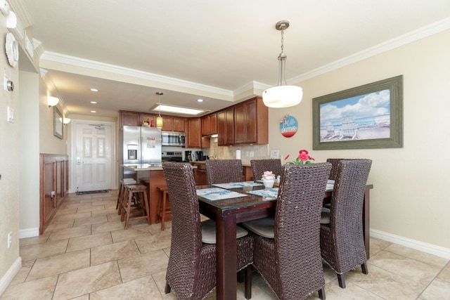 dining room featuring ornamental molding