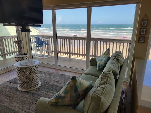 living room featuring plenty of natural light and a water view