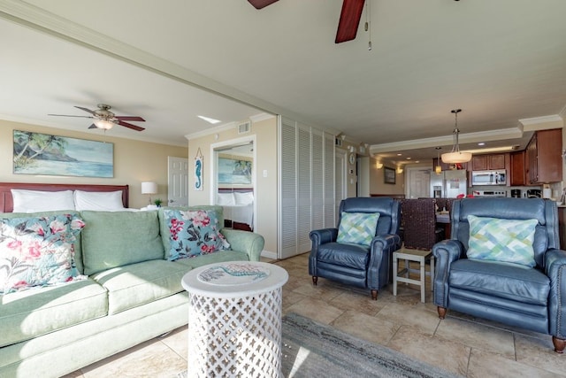 living room with ornamental molding and ceiling fan