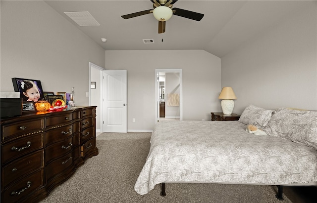 carpeted bedroom featuring connected bathroom, vaulted ceiling, and ceiling fan