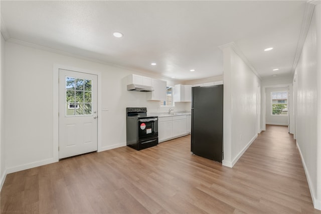 kitchen featuring light hardwood / wood-style floors, white cabinets, black appliances, sink, and ornamental molding