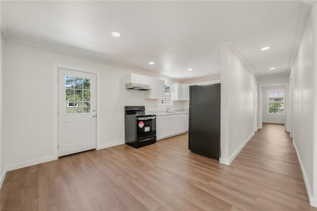 5506 Curtis Clark Dr, Corpus Christi, TX 78411 - kitchen with black appliances, under cabinet range hood, light countertops, ornamental molding, and plenty of natural light