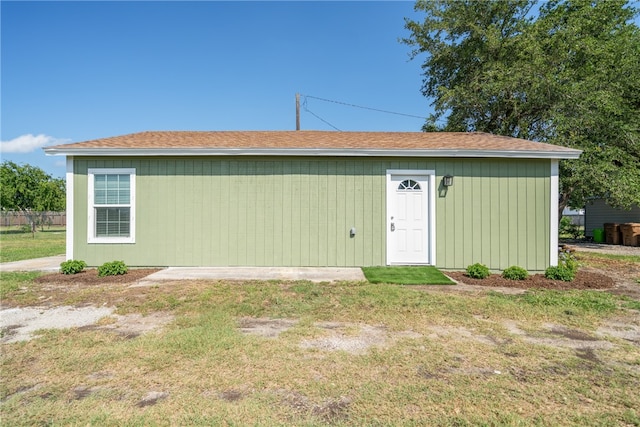 view of outbuilding with a yard