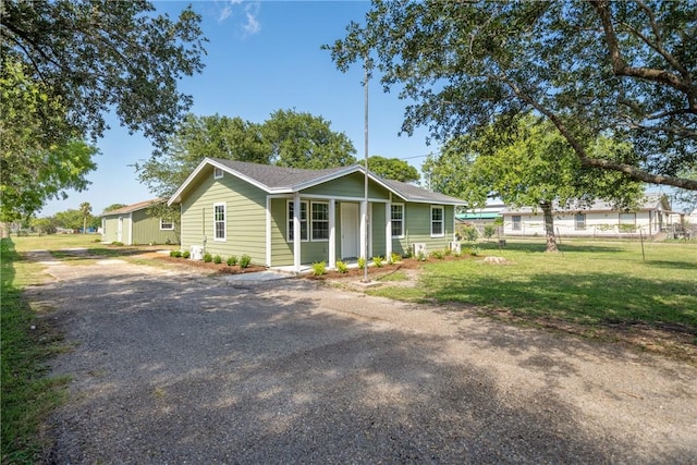 5506 Curtis Clark Dr, Corpus Christi, TX 78411 - ranch-style home with a front lawn