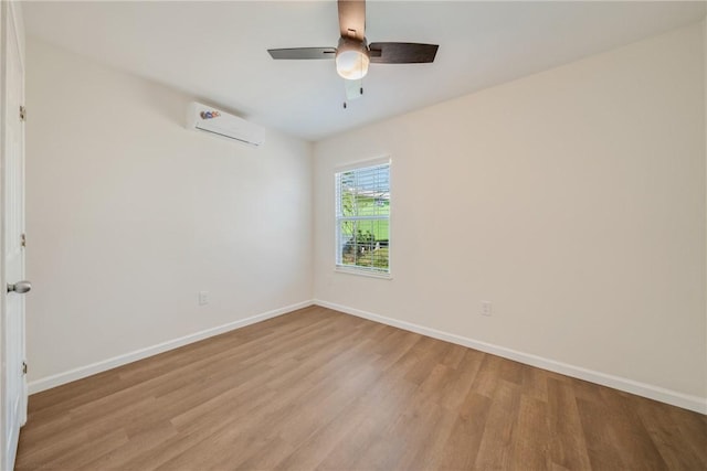 5506 Curtis Clark Dr, Corpus Christi, TX 78411 - empty room with light wood-style floors, a wall mounted AC, and ceiling fan
