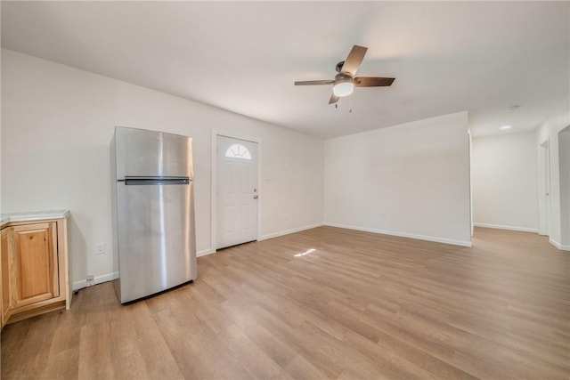 5506 Curtis Clark Dr, Corpus Christi, TX 78411 - unfurnished living room featuring ceiling fan and light wood-style flooring