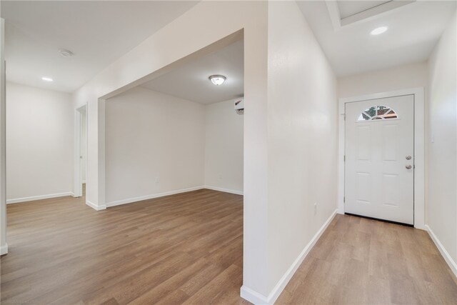 foyer entrance with light wood-type flooring