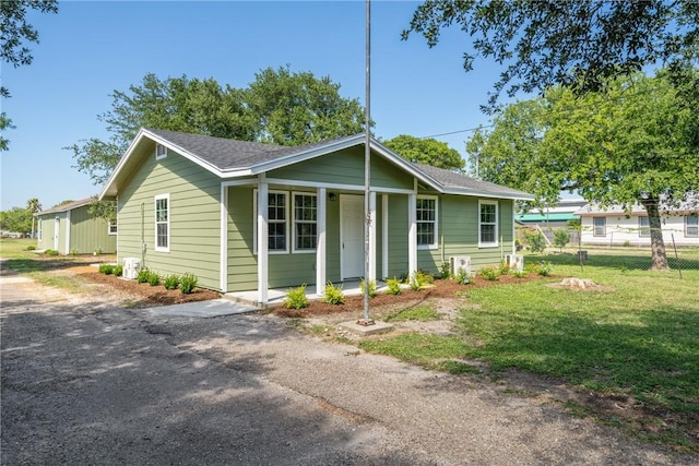 5506 Curtis Clark Dr, Corpus Christi, TX 78411 - ranch-style home featuring covered porch and a shingled roof