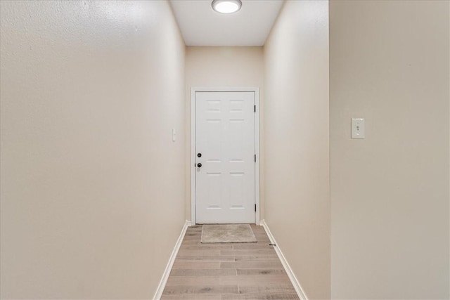 13656 Teague, Corpus Christi, TX 78410 - doorway with light wood-type flooring and baseboards