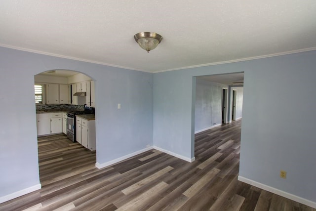 interior space featuring crown molding and dark hardwood / wood-style flooring