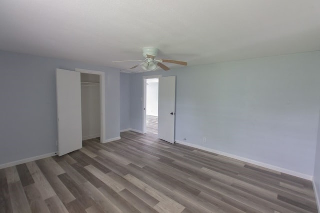 unfurnished bedroom with hardwood / wood-style flooring and ceiling fan