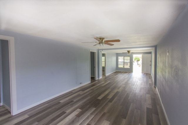 interior space featuring dark wood-type flooring and ceiling fan