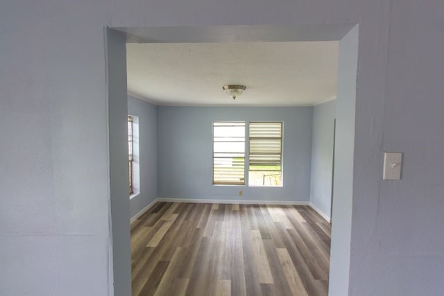 unfurnished room featuring hardwood / wood-style floors