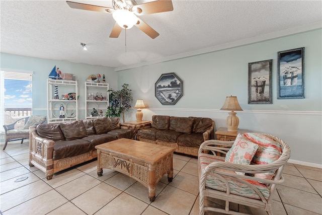 living room featuring light tile patterned flooring and a textured ceiling