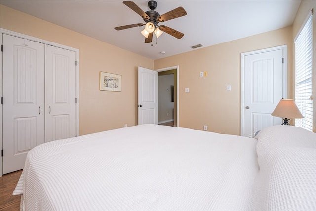 bedroom featuring hardwood / wood-style floors and ceiling fan