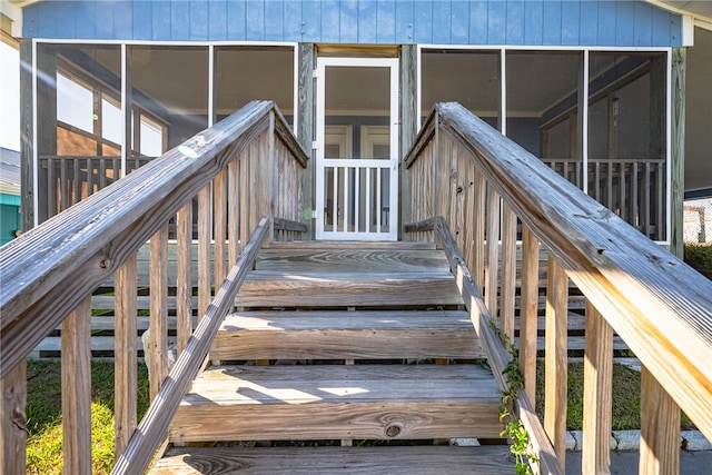 property entrance with a deck