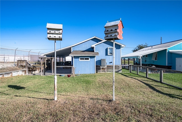 exterior space with an outbuilding and a yard