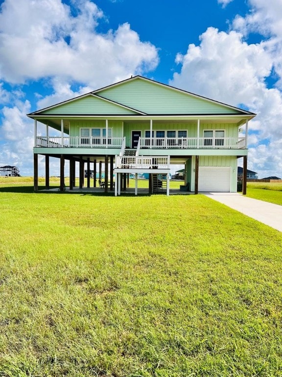 view of front of home with a front yard and a garage