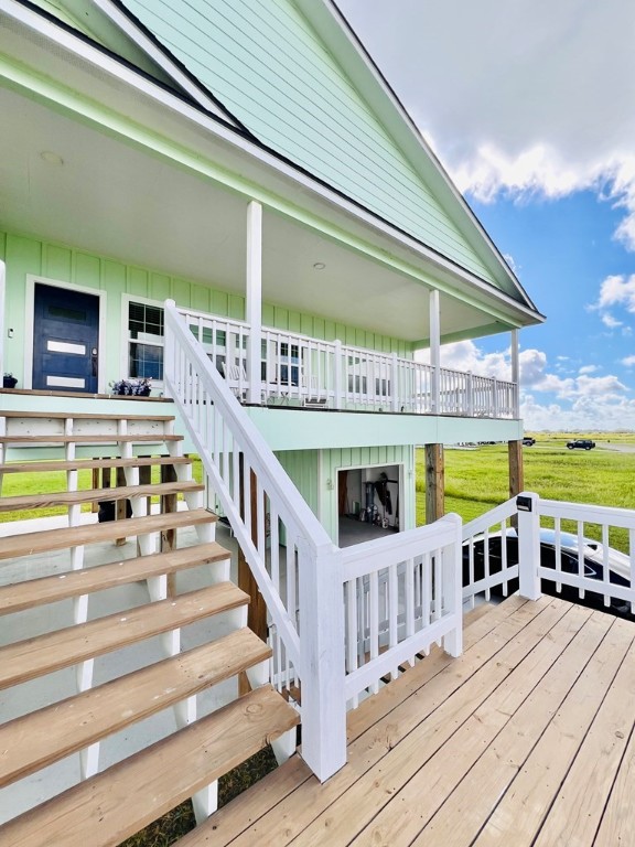 wooden terrace with a yard