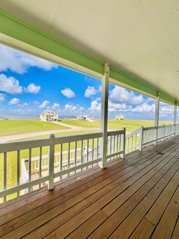 wooden deck featuring a yard