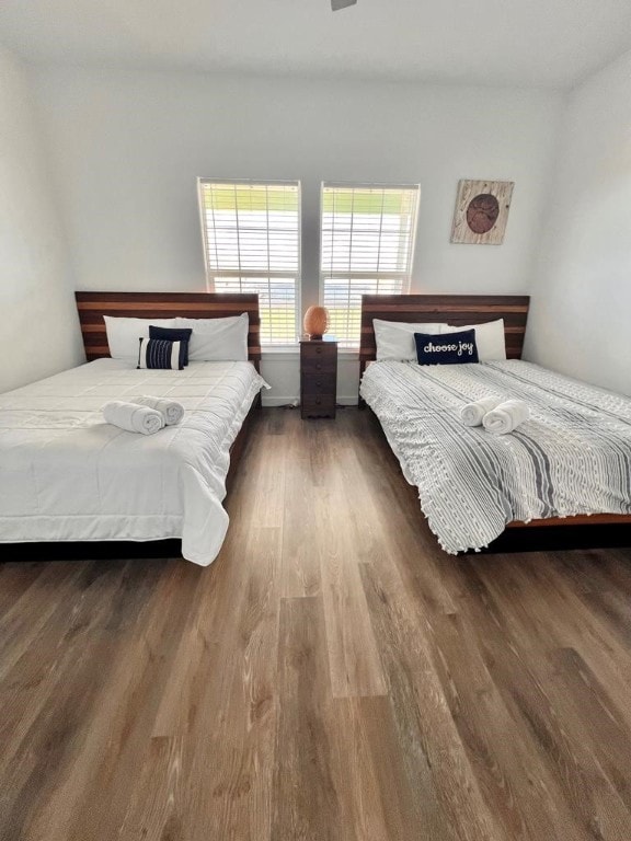 bedroom featuring dark wood-type flooring