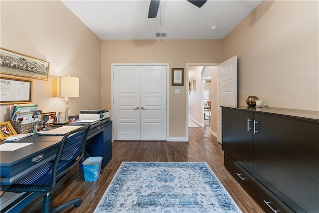 office space featuring dark wood-type flooring and ceiling fan