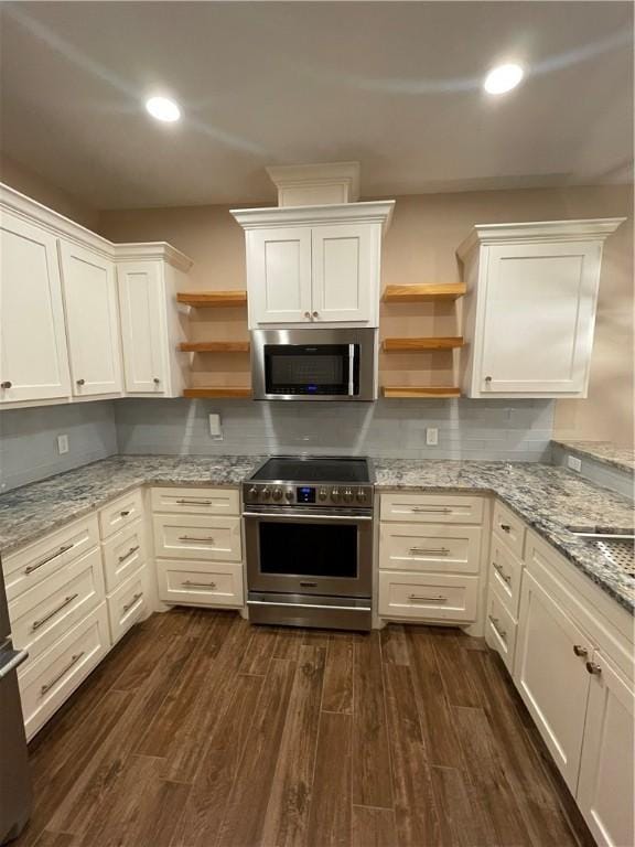 5422 Neela Ln, Corpus Christi, TX 78413 - kitchen with appliances with stainless steel finishes, open shelves, dark wood-style floors, white cabinets, and recessed lighting