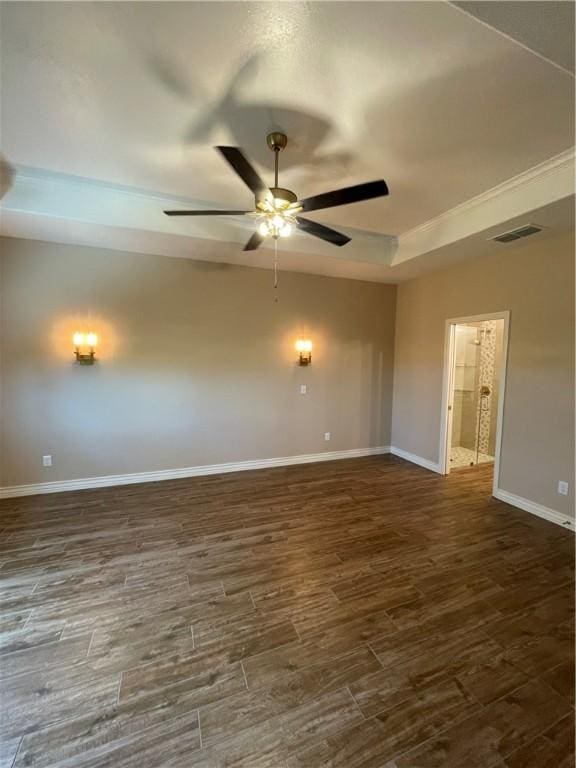 5422 Neela Ln, Corpus Christi, TX 78413 - empty room featuring ceiling fan, baseboards, dark wood-style flooring, and a tray ceiling